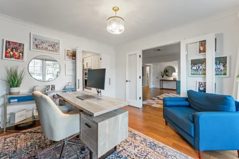 a living room with furniture and a table