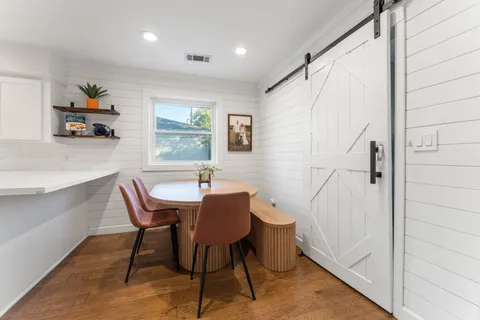 a view of a dining room with furniture