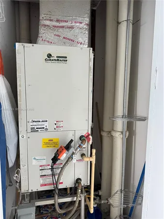 a view of storage and utility room with washer and dryer