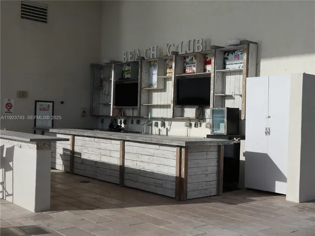 a spacious bathroom with a double vanity sink and a mirror