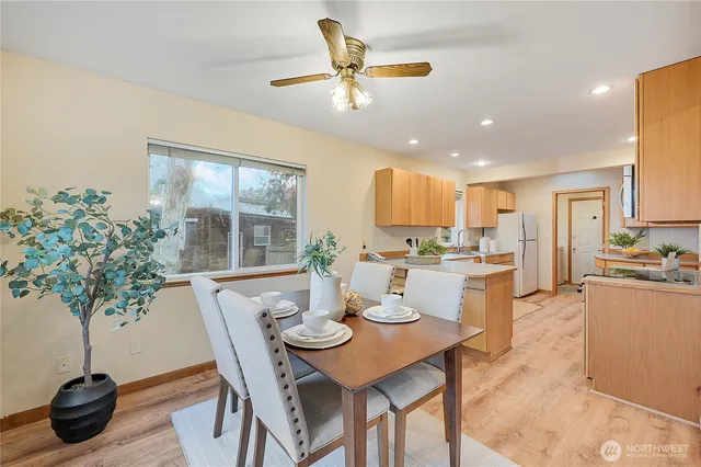 a view of a dining room with furniture window and wooden floor