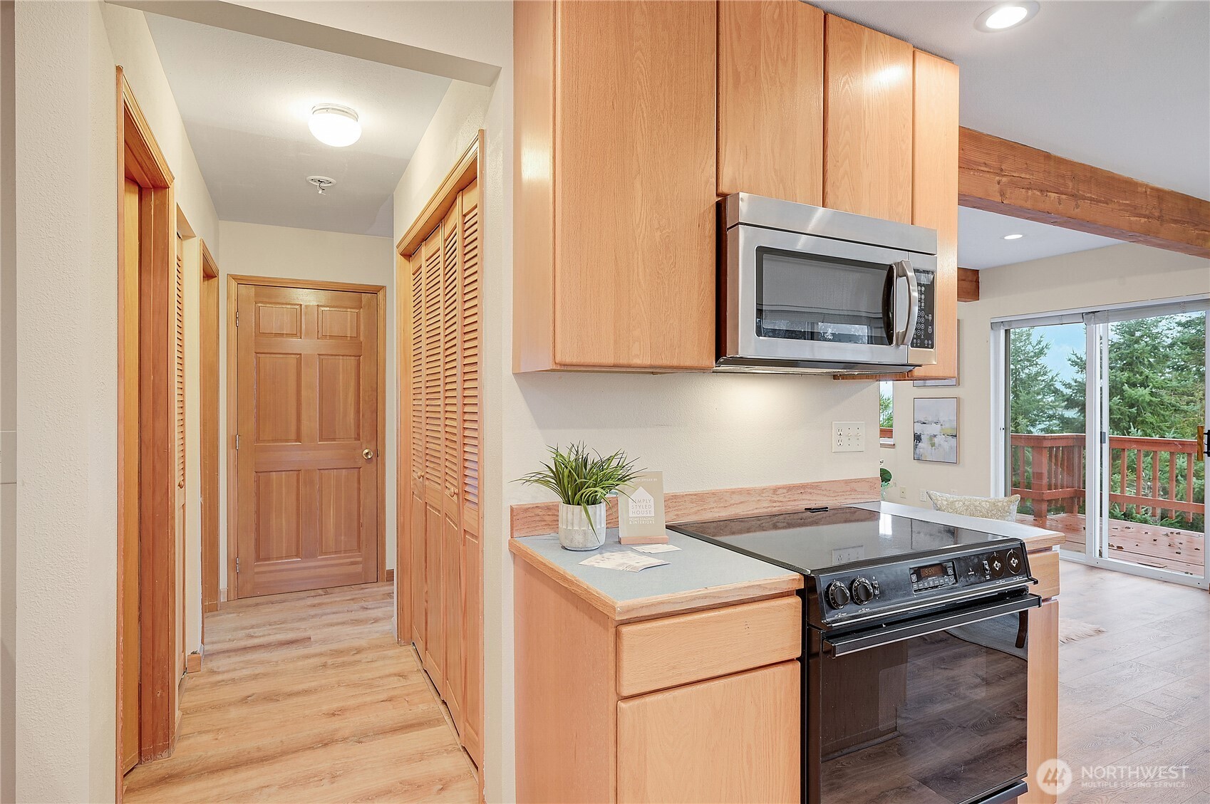 320 North Street Sequim, WA 98382 - Photo 17 of 40 a kitchen with a stove microwave and sink