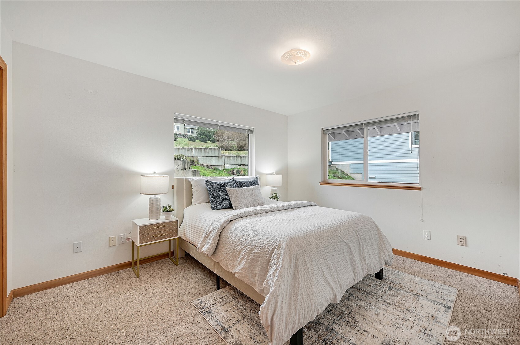 320 North Street Sequim, WA 98382 - Photo 21 of 40 a bedroom with a bed and a window