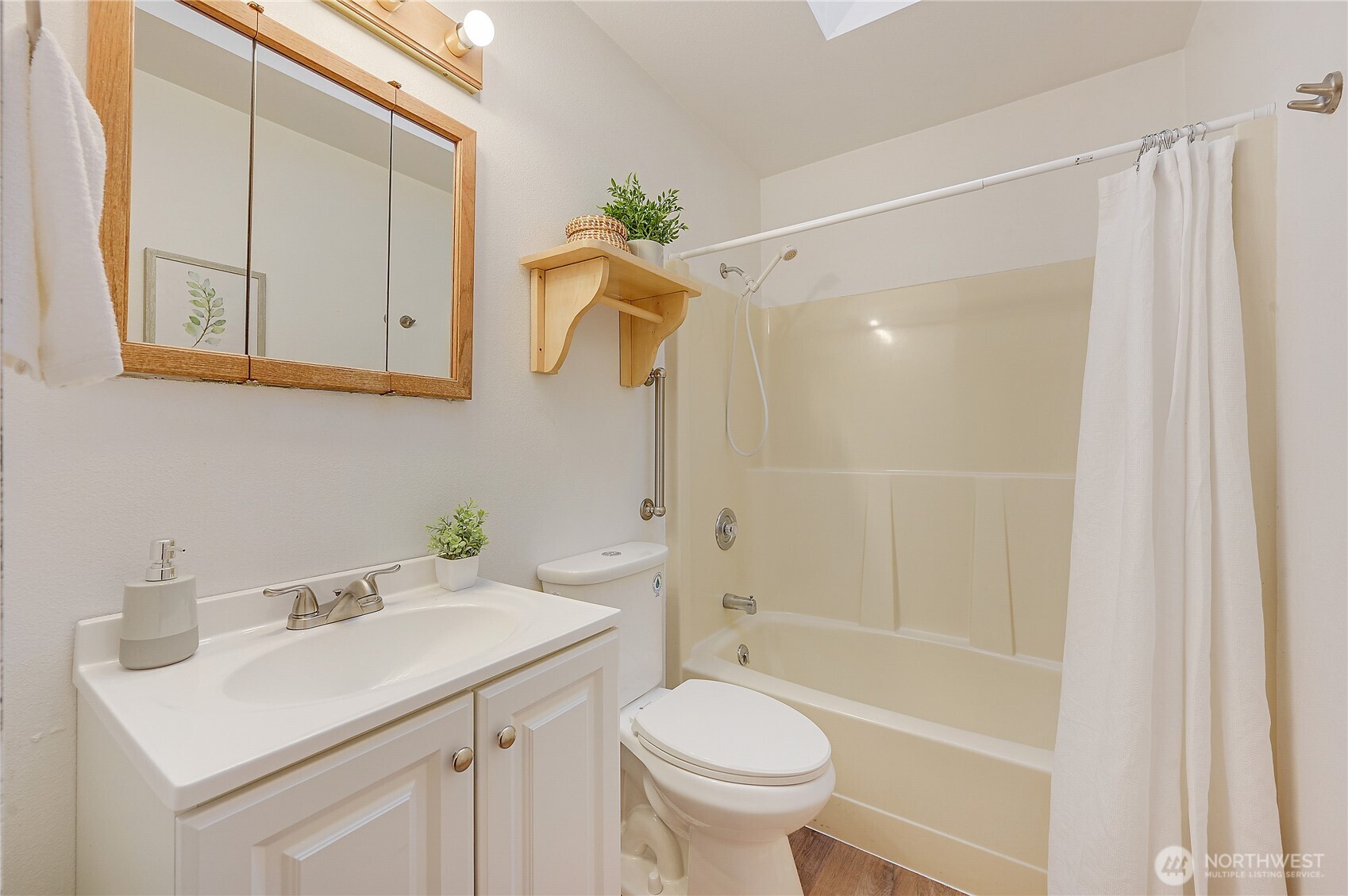 320 North Street Sequim, WA 98382 - Photo 22 of 40 a bathroom with a sink a toilet and shower