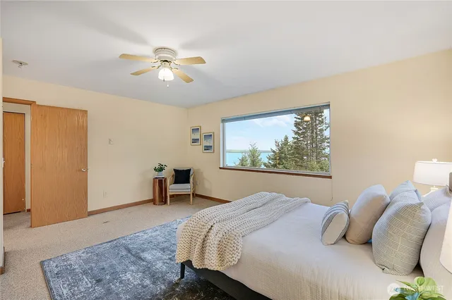 a bedroom with a bed and window