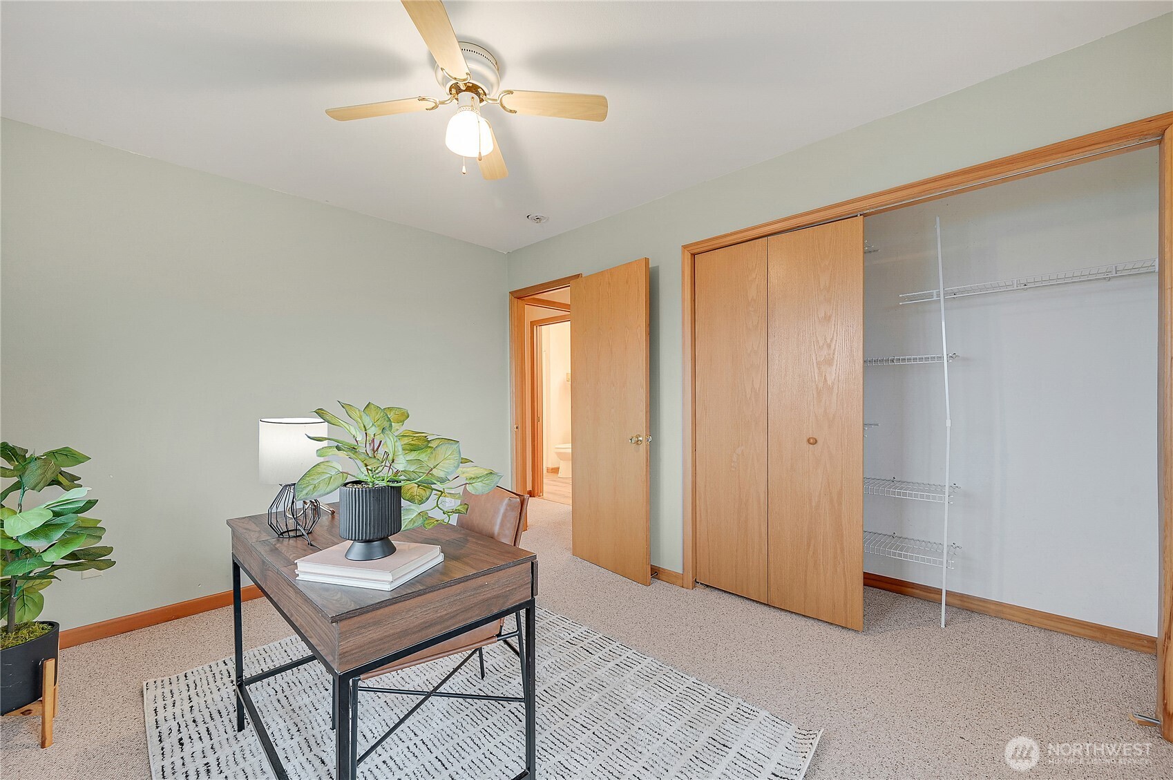 320 North Street Sequim, WA 98382 - Photo 33 of 40 a workspace with furniture and a potted plant