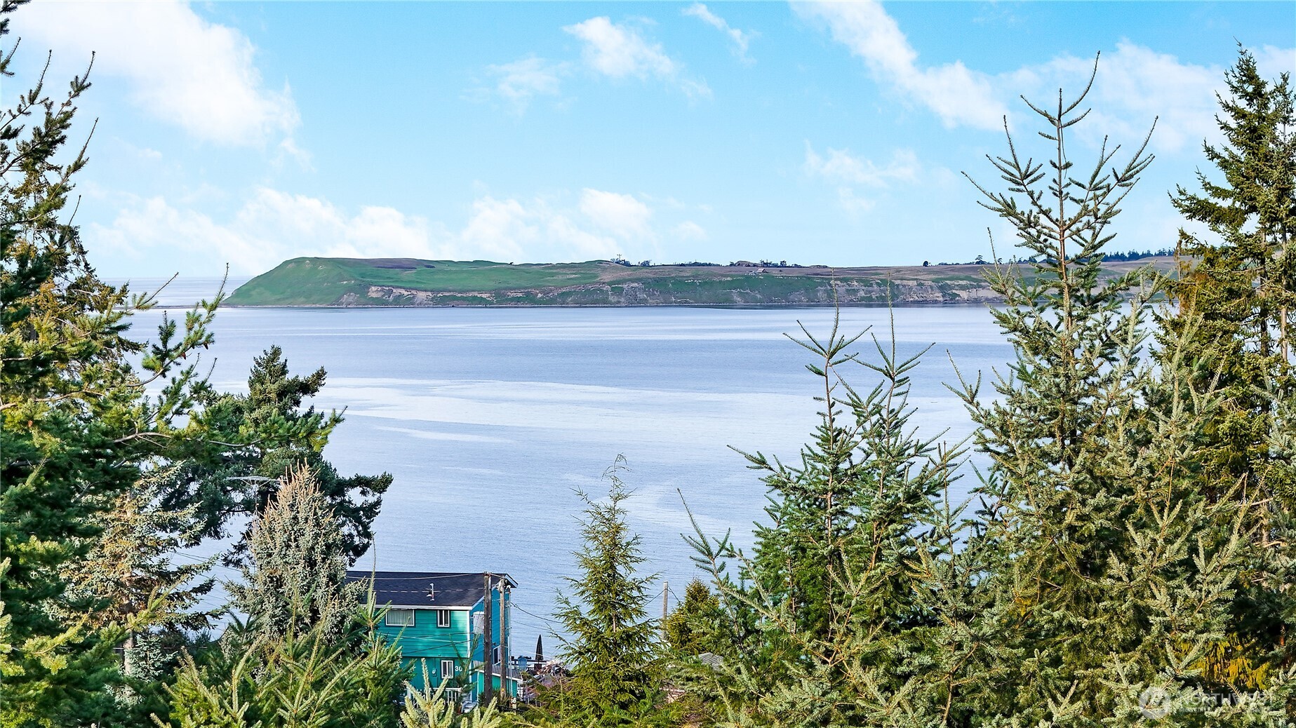320 North Street Sequim, WA 98382 - Photo 4 of 40 a view of a lake with a mountain in front of it