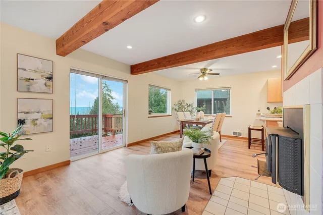 a living room with furniture and large windows