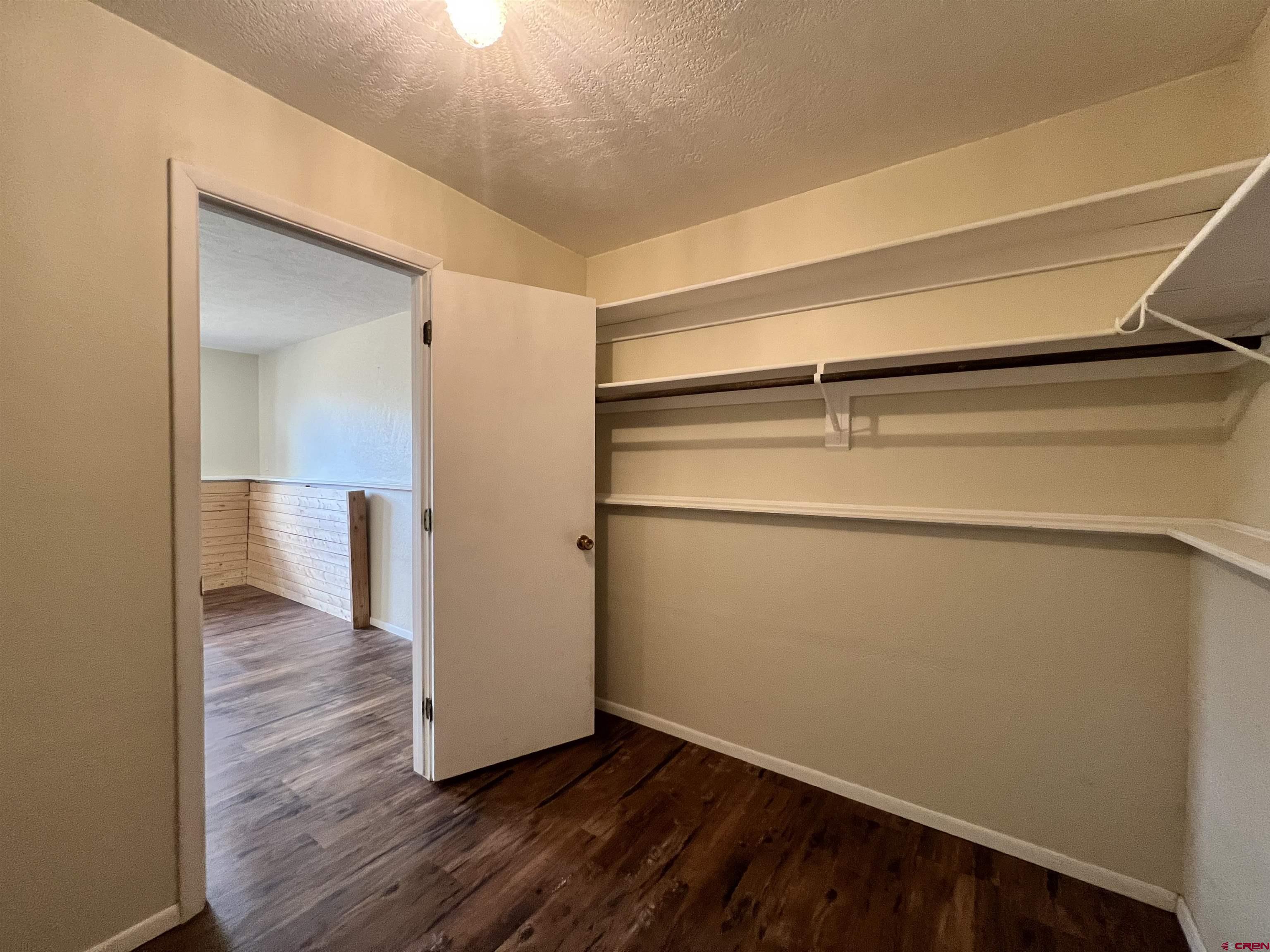 1328 Jackson Street Cortez, CO 81321 - Photo 21 of 37 a view of a room with wooden floor