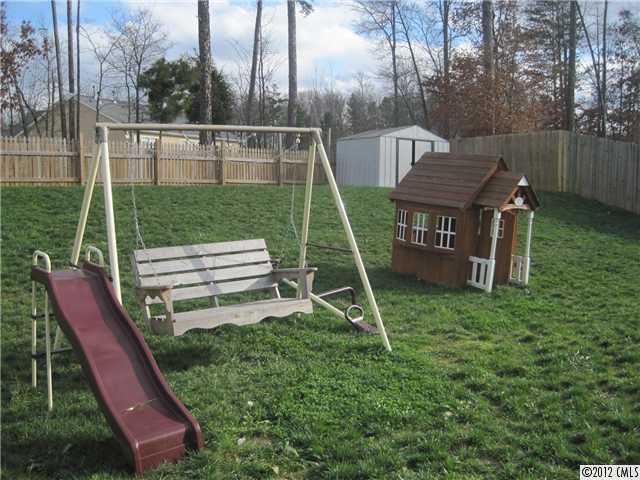 5927 Brightstar Valley Road Mint Hill, NC 28227 - Photo 2 of 14 a view of a backyard with sitting area and wooden