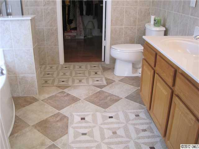 5927 Brightstar Valley Road Mint Hill, NC 28227 - Photo 12 of 14 a bathroom with a sink and a toilet