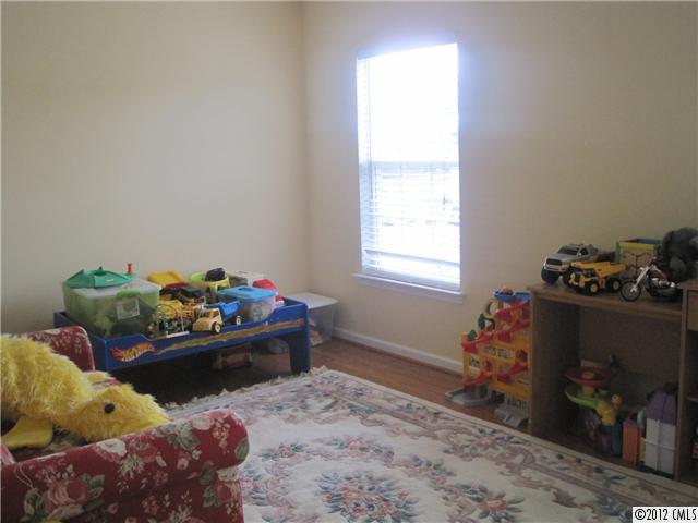5927 Brightstar Valley Road Mint Hill, NC 28227 - Photo 13 of 14 a bed room with furniture and a window