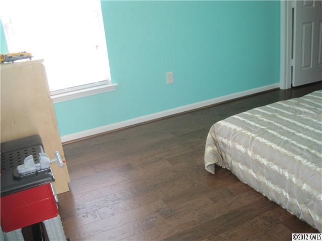 5927 Brightstar Valley Road Mint Hill, NC 28227 - Photo 14 of 14 a bed sitting in a bedroom next to a window