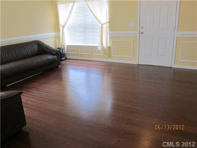 5927 Brightstar Valley Road Mint Hill, NC 28227 - Photo 7 of 14 a living room with hard wood floors and a window