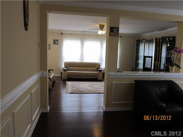 5927 Brightstar Valley Road Mint Hill, NC 28227 - Photo 8 of 14 a hallway with wooden floor and windows