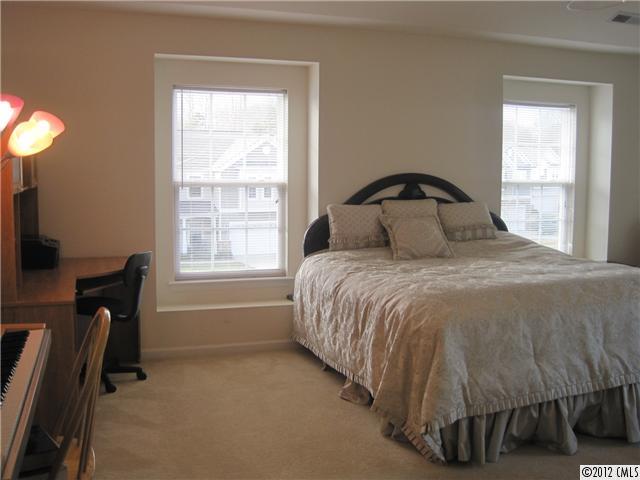 5927 Brightstar Valley Road Mint Hill, NC 28227 - Photo 10 of 14 a bedroom with a bed and a window
