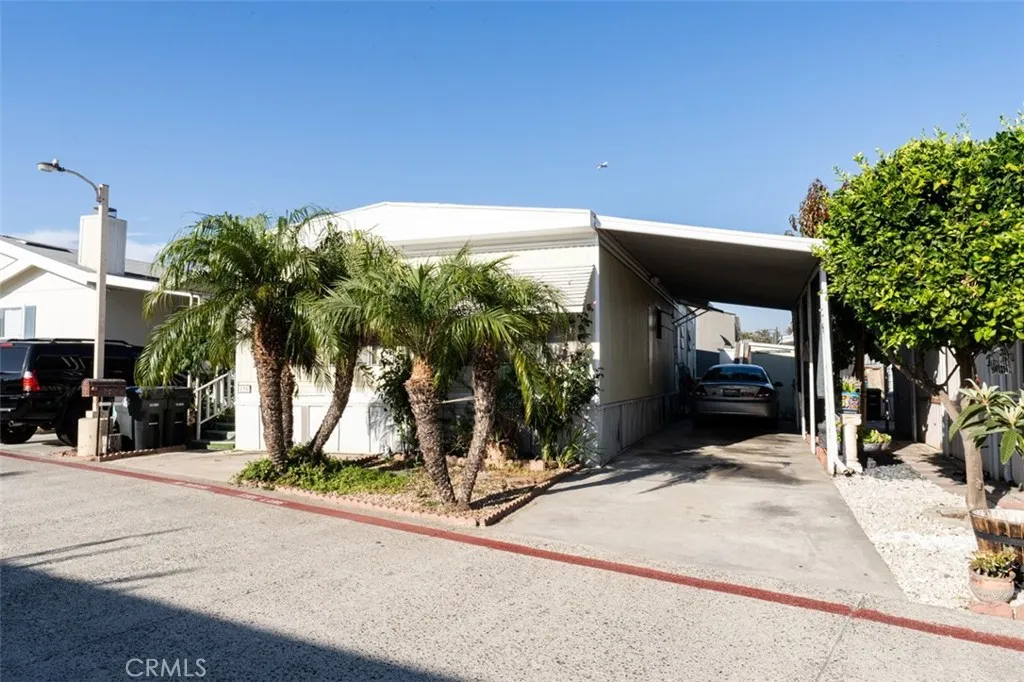 131 South Colombo Tustin, CA 92780 - Photo 3 of 19 a view of a house with backyard and tree