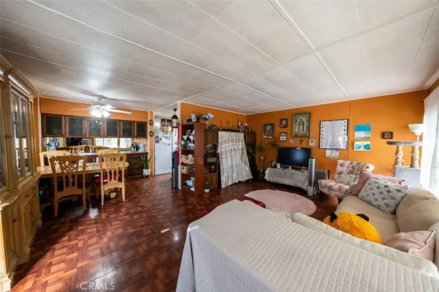 a living room filled with furniture and a large window