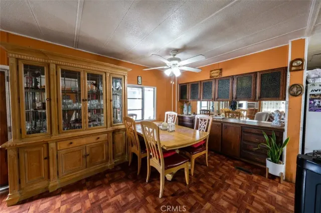 a dining area with furniture and window