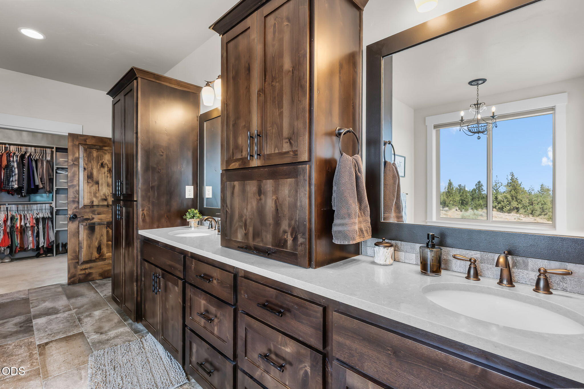13601 Southwest Harrison Way Powell Butte, OR 97753 - Photo 37 of 81 a bathroom with double vanity and a mirror
