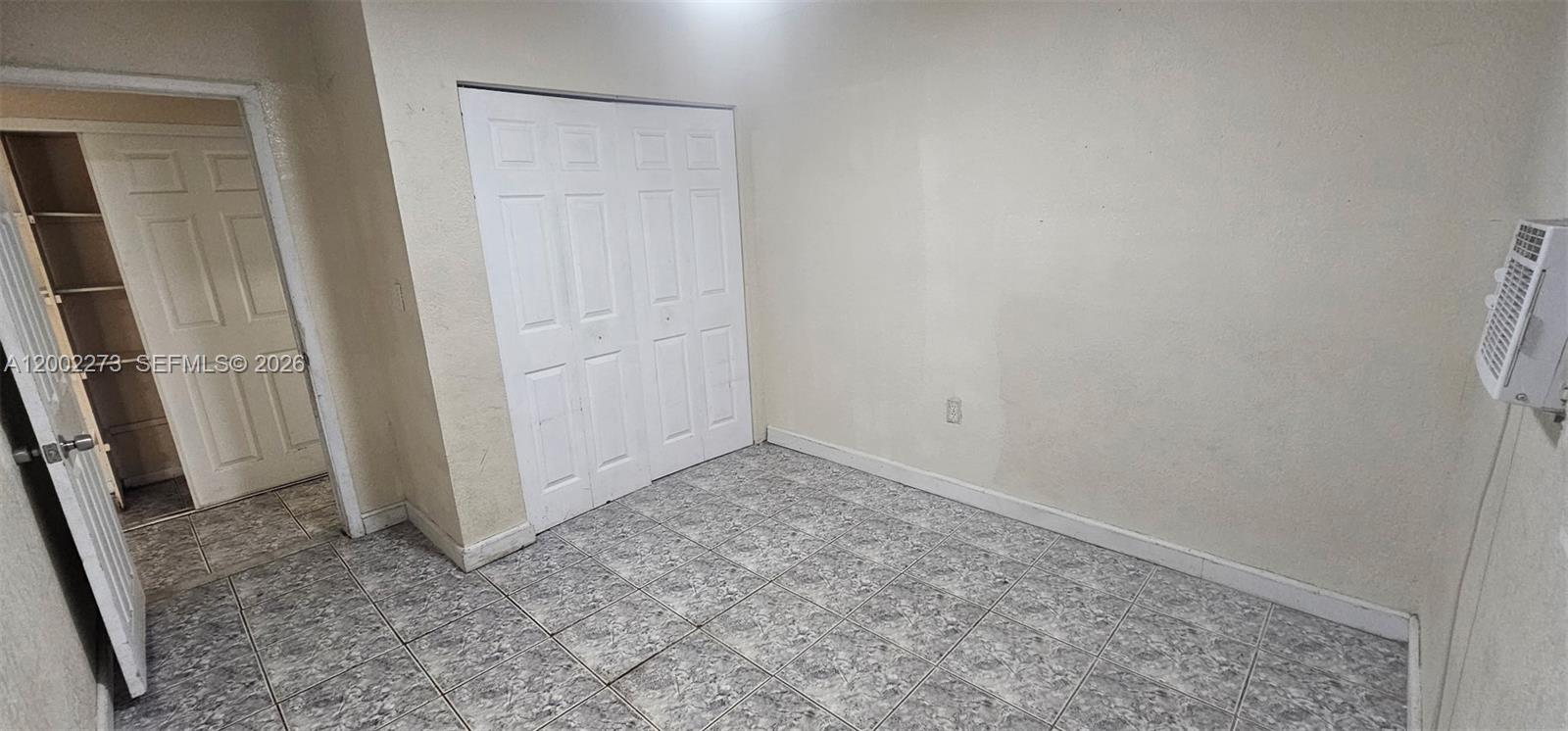 3932 Northwest 207 St Road Miami Gardens, FL 33055 - Photo 17 of 19 an empty room with windows