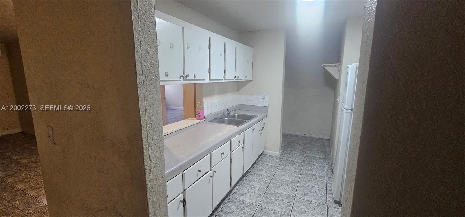 3932 Northwest 207 St Road Miami Gardens, FL 33055 - Photo 4 of 19 a kitchen with white cabinets