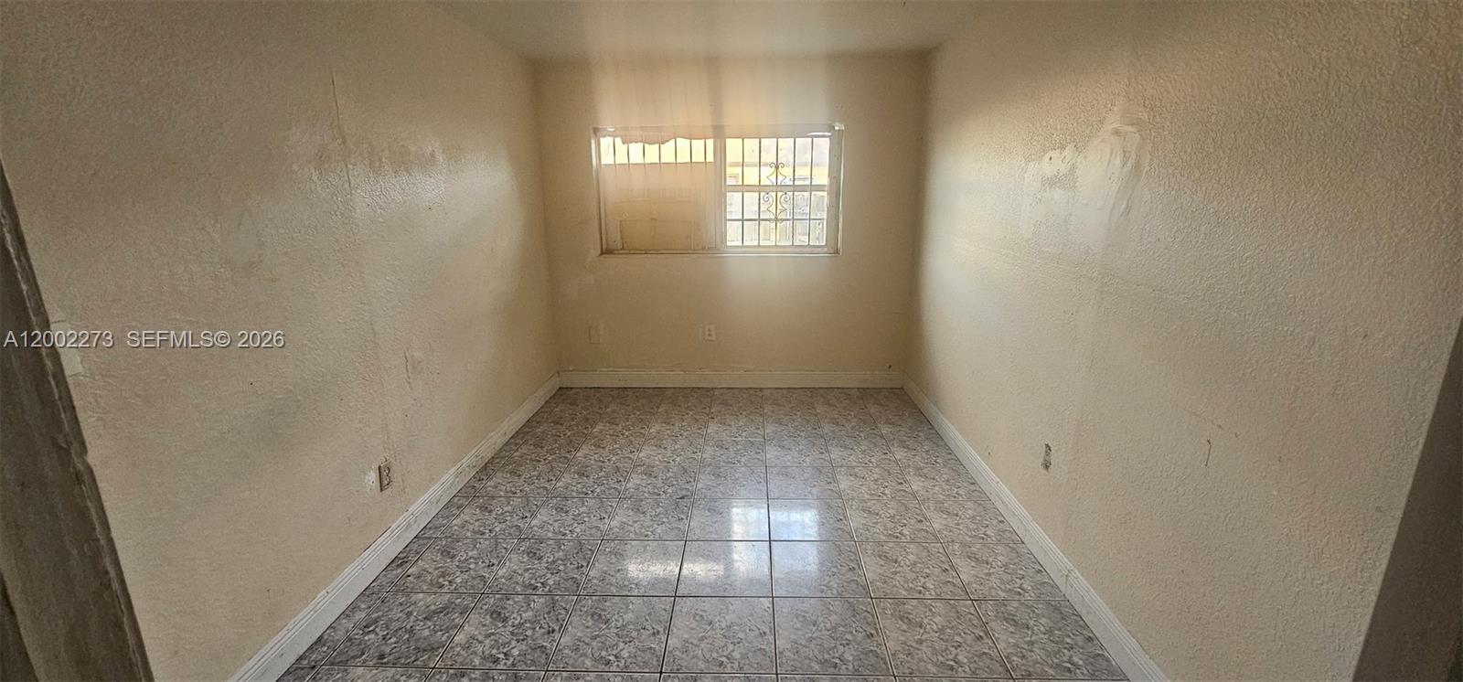 3932 Northwest 207 St Road Miami Gardens, FL 33055 - Photo 9 of 19 an empty room with windows