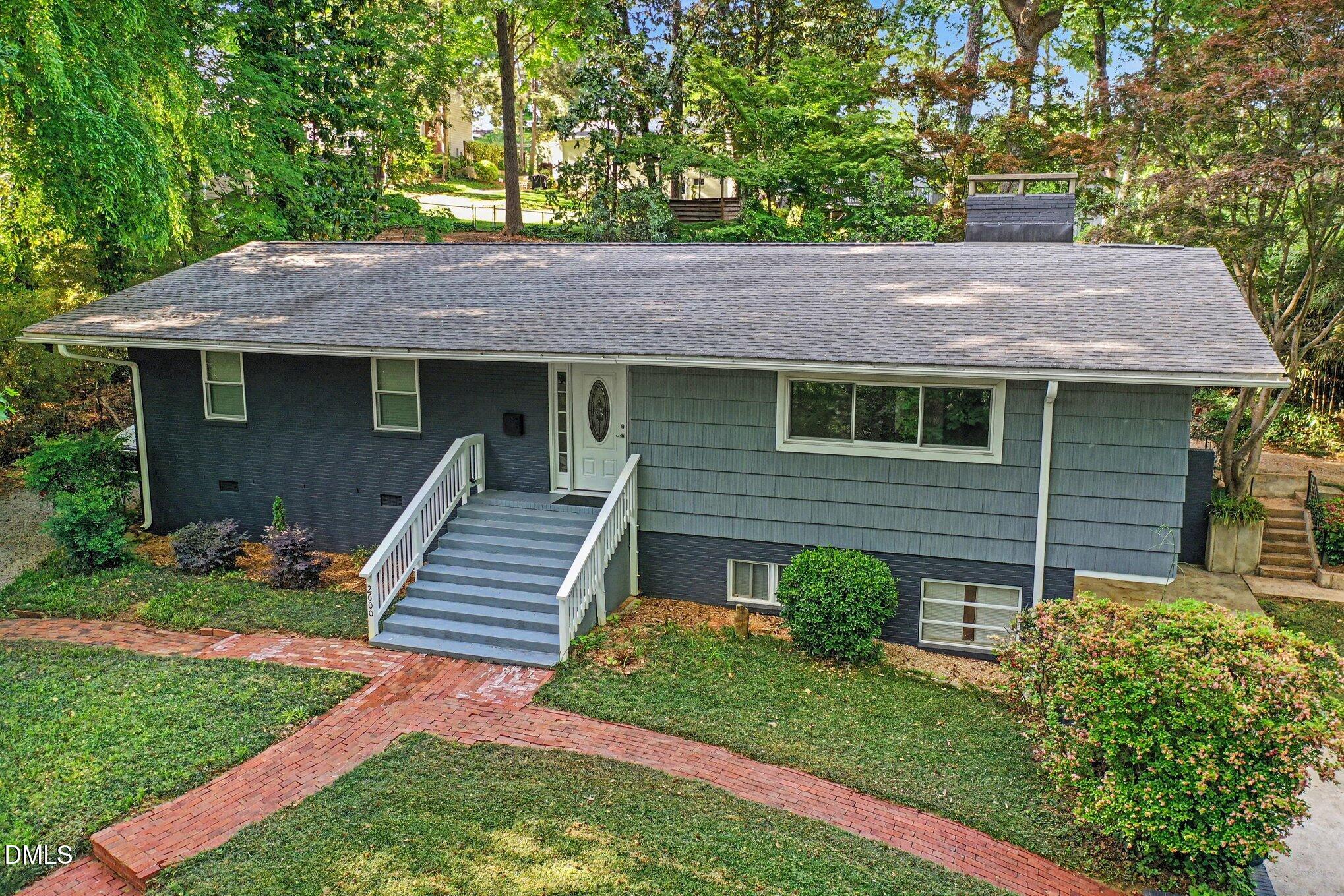 2600 Wade Avenue Raleigh, NC 27607 - Photo 26 of 31 a front view of a house with a yard