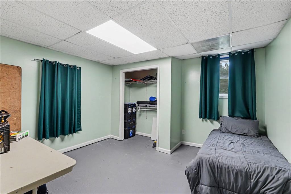 7388 Post Road Winston, GA 30187 - Photo 24 of 32 a bed room with a bed and a window