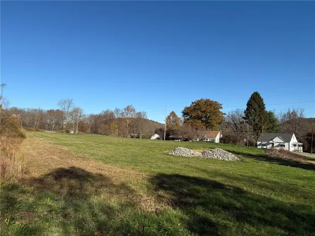 a view of a town with big trees