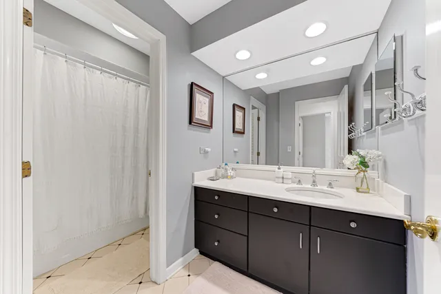 a bathroom with a double vanity sink and a mirror