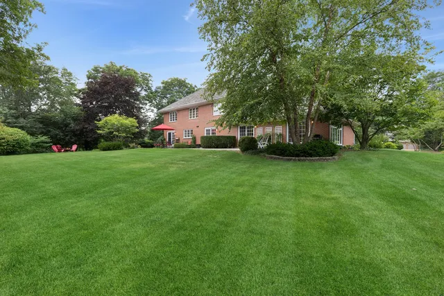 a view of a tree in front of a house