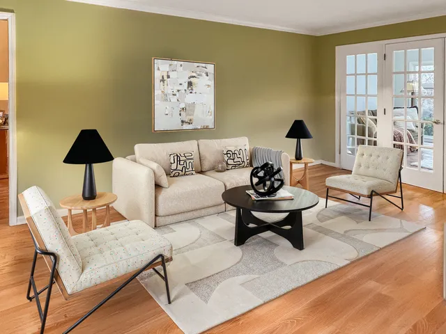 a living room with furniture and a table