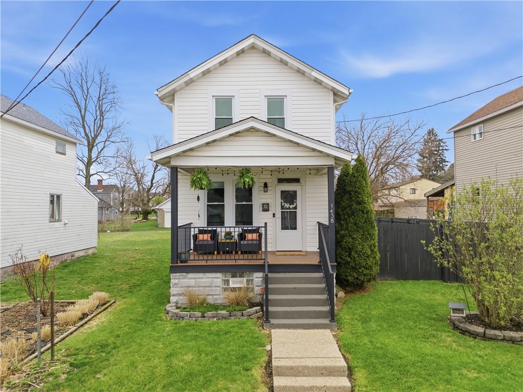1438 4th Street Natrona Heights, PA 15065 - Photo 1 of 33 a front view of a house with garden
