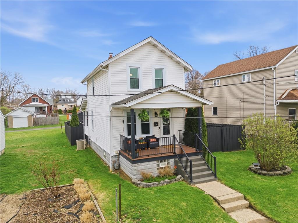 1438 4th Street Natrona Heights, PA 15065 - Photo 2 of 33 a front view of a house with garden