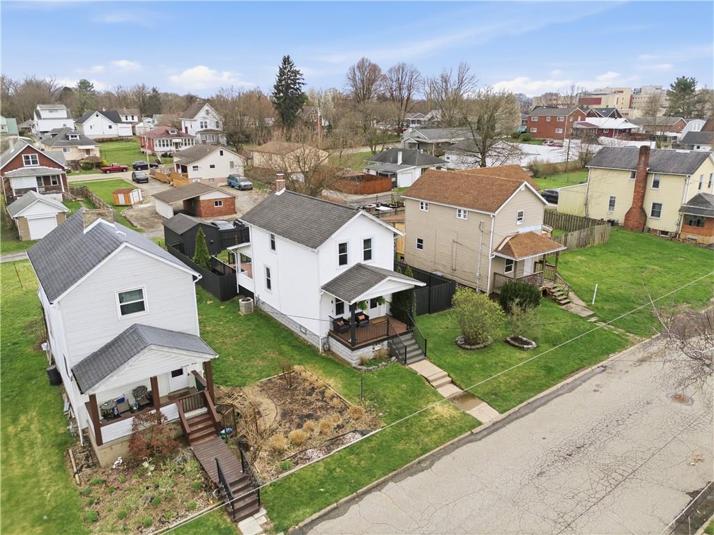 1438 4th Street Natrona Heights, PA 15065 - Photo 3 of 33 an aerial view of a house with garden space and street view