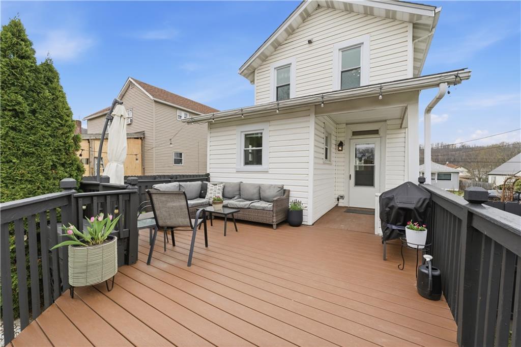 1438 4th Street Natrona Heights, PA 15065 - Photo 5 of 33 a view of a house with wooden deck and furniture