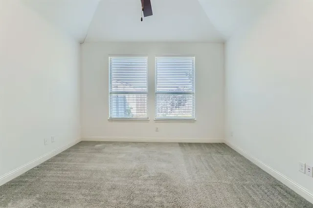 a spacious bathroom with a tub sink and mirror