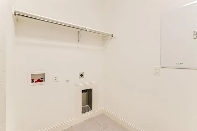 a view of a porch with a table and chairs