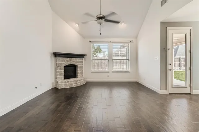 a view of kitchen with stainless steel appliances refrigerator sink and cabinets