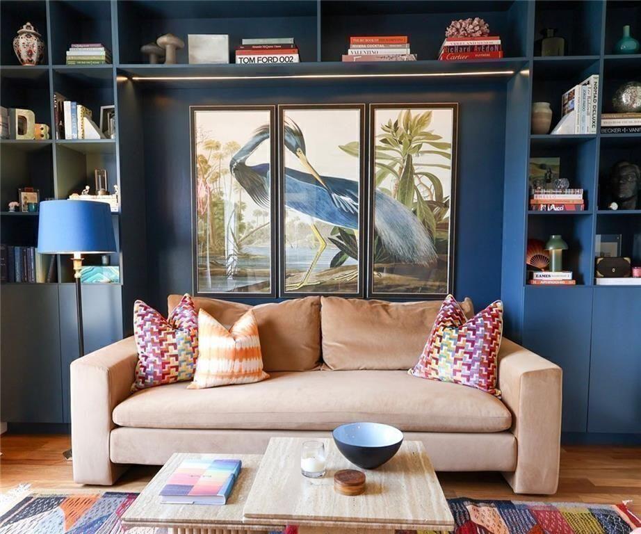 1101 Juniper Street Northeast, Unit 1411 Atlanta, GA 30309 - Photo 1 of 1 a living room with furniture and a floor to ceiling window