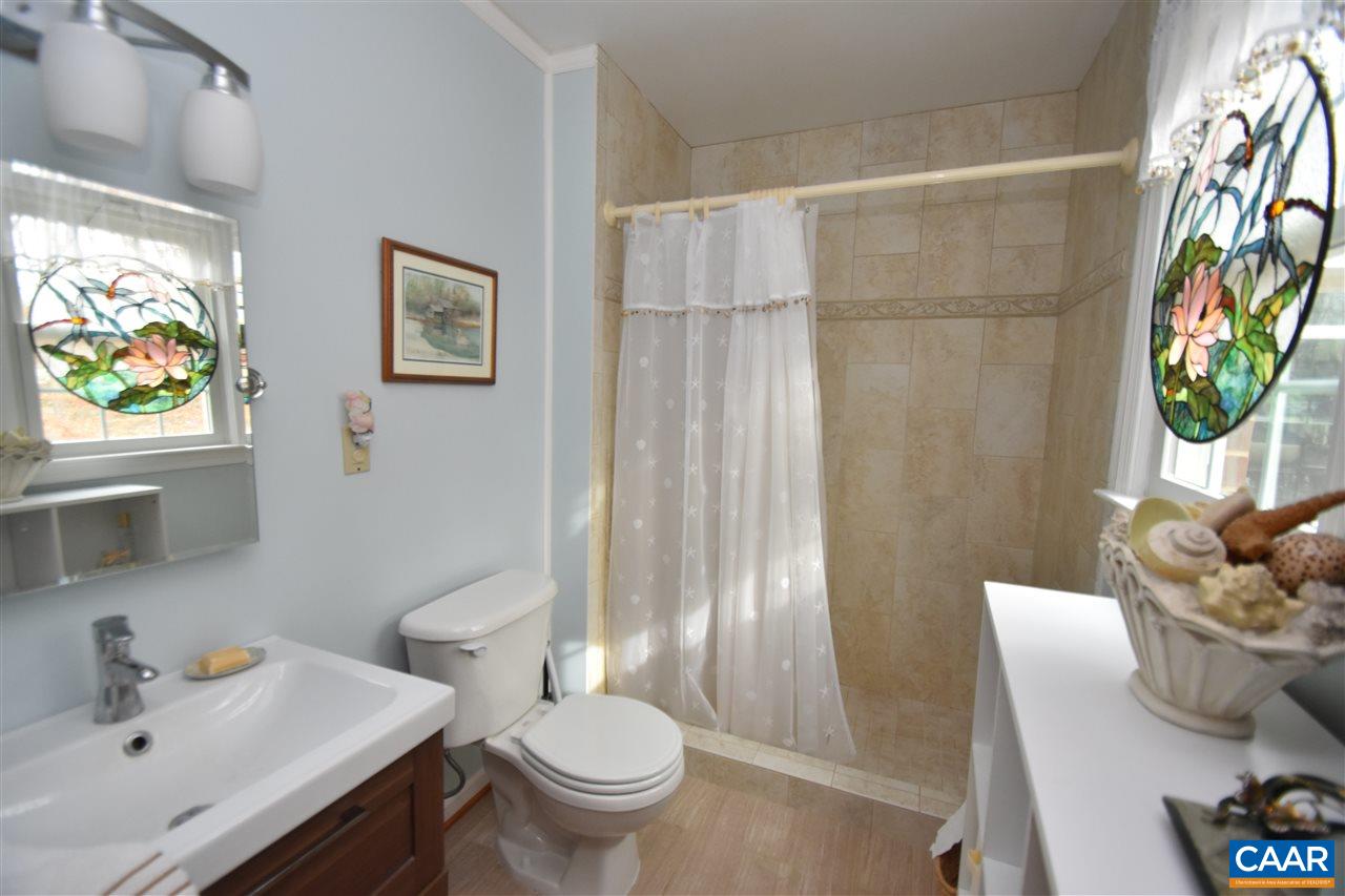 304 Westminster Road Charlottesville, VA 22901 - Photo 21 of 32 a bathroom with a sink toilet and shower