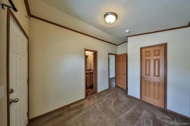 an empty room with closet area