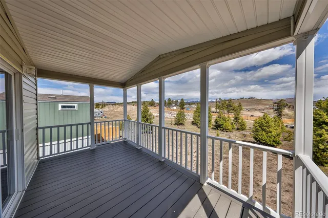 a view of a porch with wooden floor
