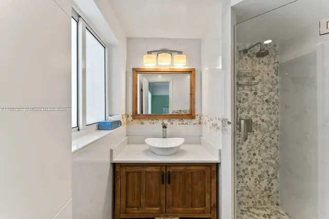 a bathroom with a sink and a mirror
