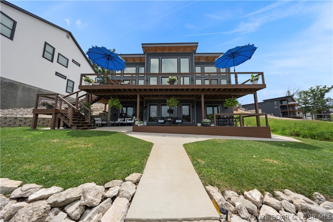 1151 Oak Road Osage Beach, MO 65065 - Photo 2 of 63 Beautiful lakeside elevation showcasing expansive