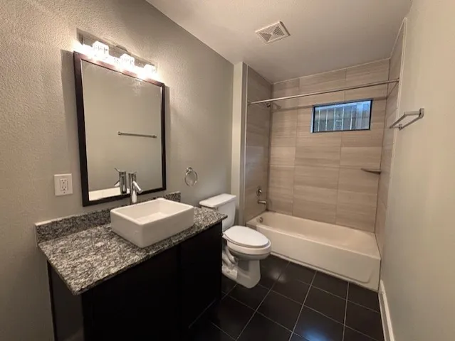 a bathroom with a sink toilet a mirror and shower