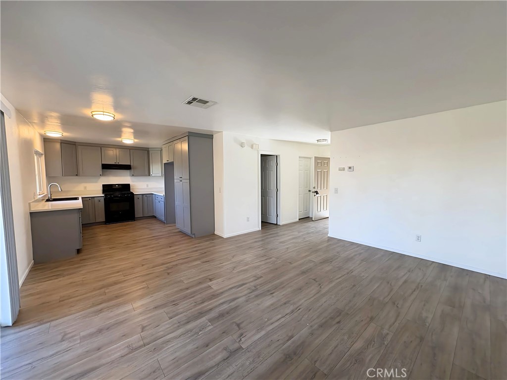 6635 Geranium Place Riverside, CA 92503 - Photo 4 of 15 a view of a kitchen with a refrigerator and a stove top oven
