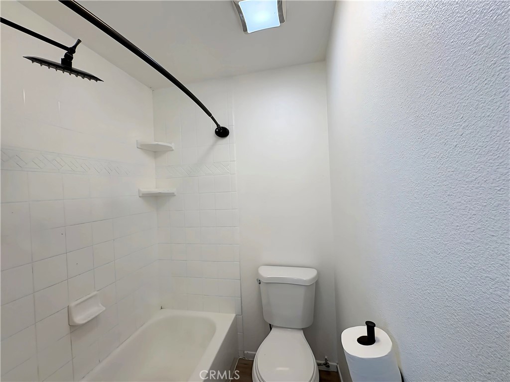 6635 Geranium Place Riverside, CA 92503 - Photo 8 of 15 a bathroom with a toilet and a shower