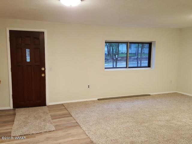 1128 East Maricopa Drive Springerville, AZ 85938 - Photo 12 of 28 an empty room with a window